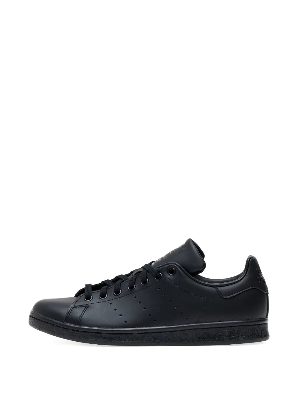 Black leather low-top lace-up sneaker in side profile with perforated toe