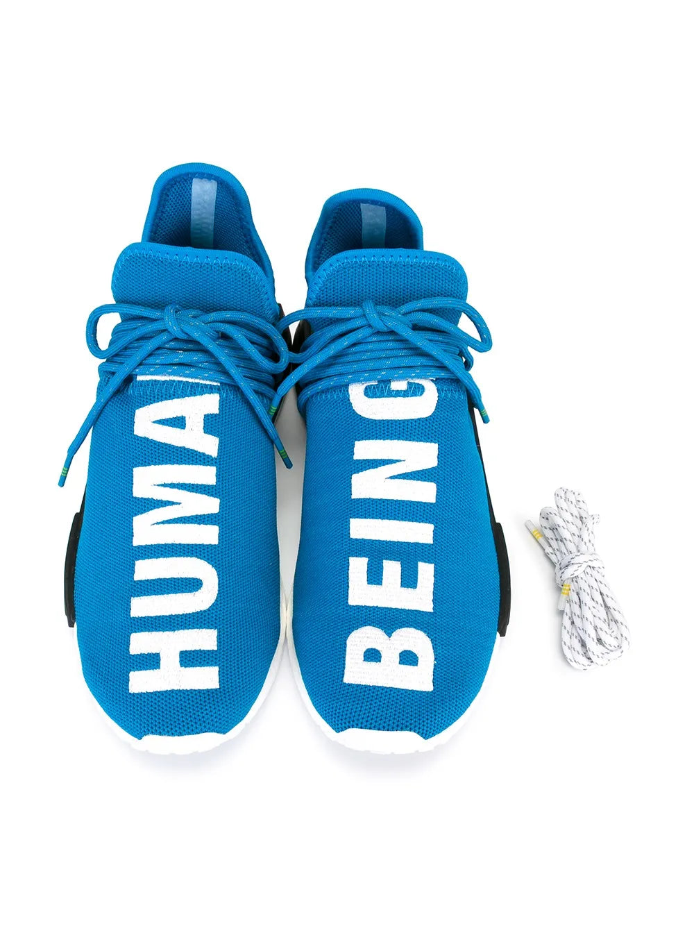 Blue lace-up sneakers with bold white “HUMAN RACE” text on knit upper