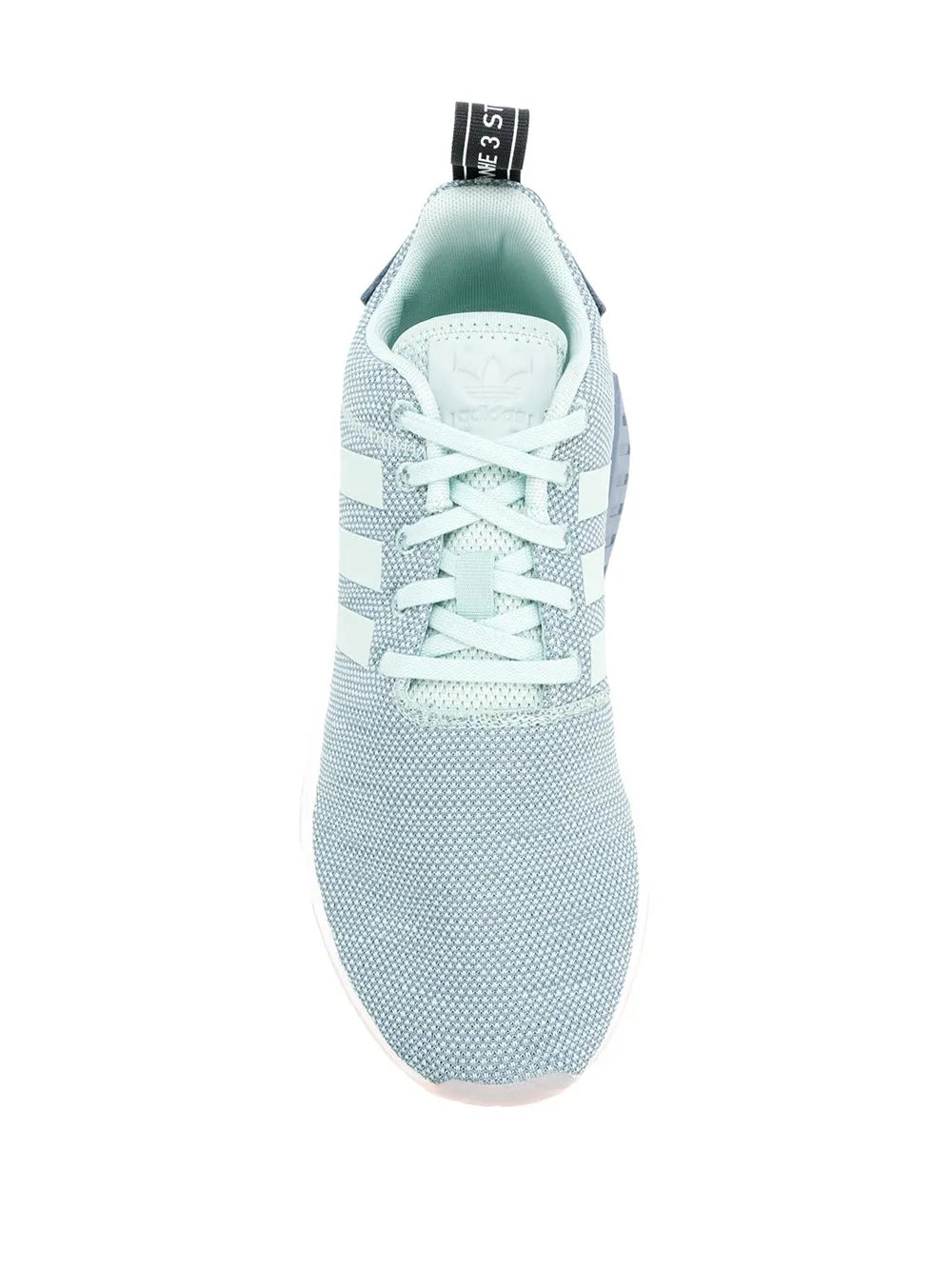 Light blue low-top sneaker close-up with lace-up front and adidas heel pull tab