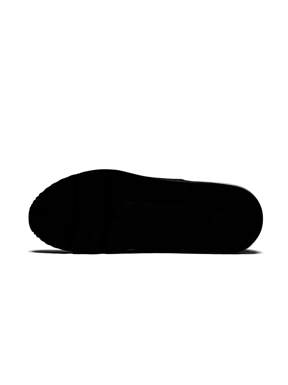 Black sneaker outsole view with textured rubber tread for traction.