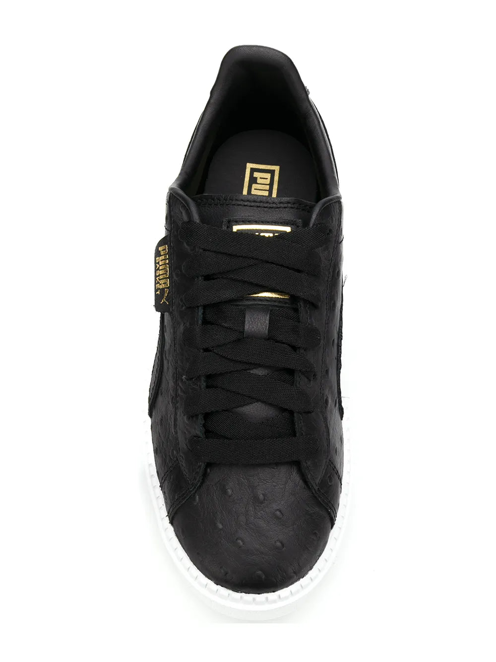 Black lace-up sneaker with gold logo tag, cushioned tongue, and white platform sole