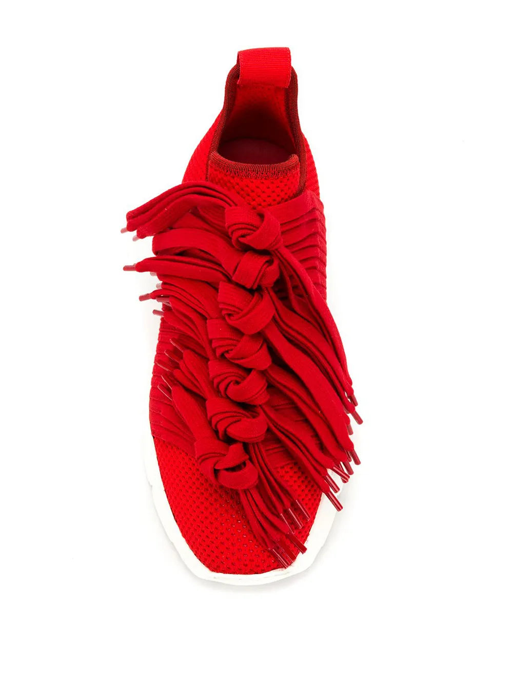 Red slip-on sneaker with knit texture, layered tassel fringe, and white sole