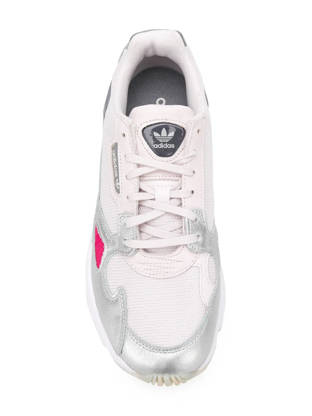 White low-top sneakers with silver toe overlay, pink side accent, lace-up