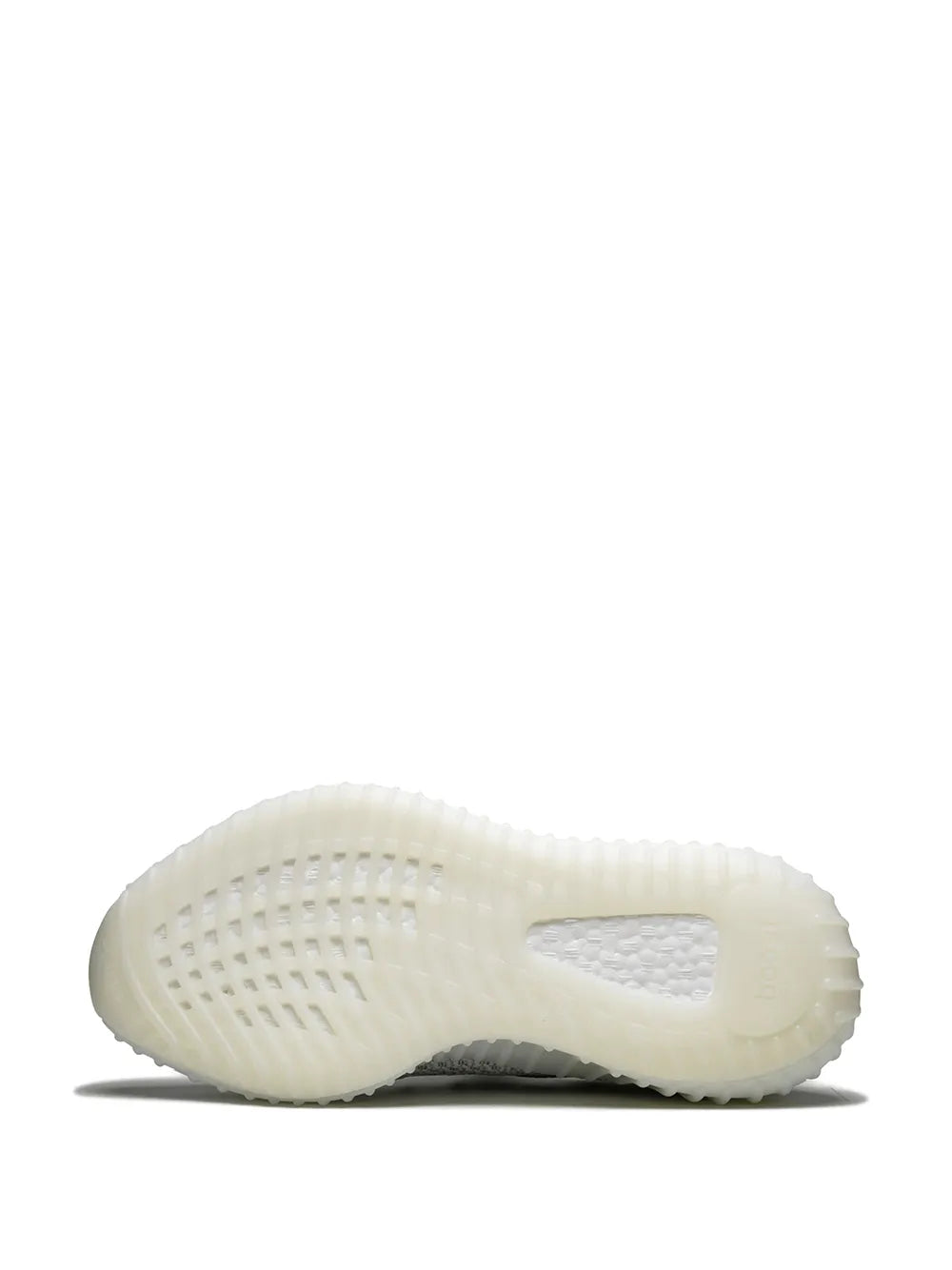 White translucent outsole with tread, heel view of reflective knit sneaker