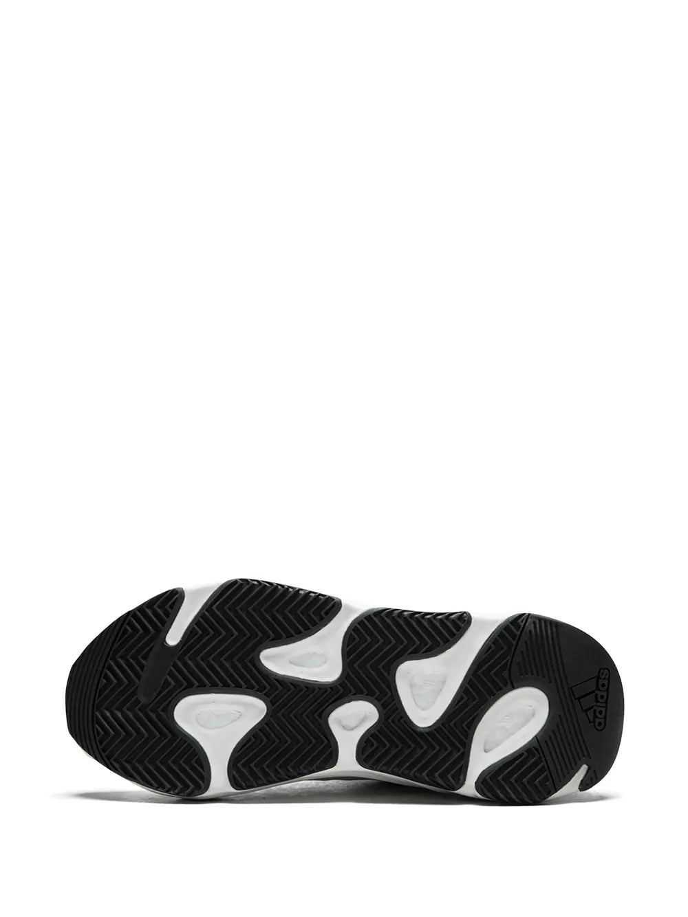Chunky sneaker outsole with black tread pattern and white sole underside