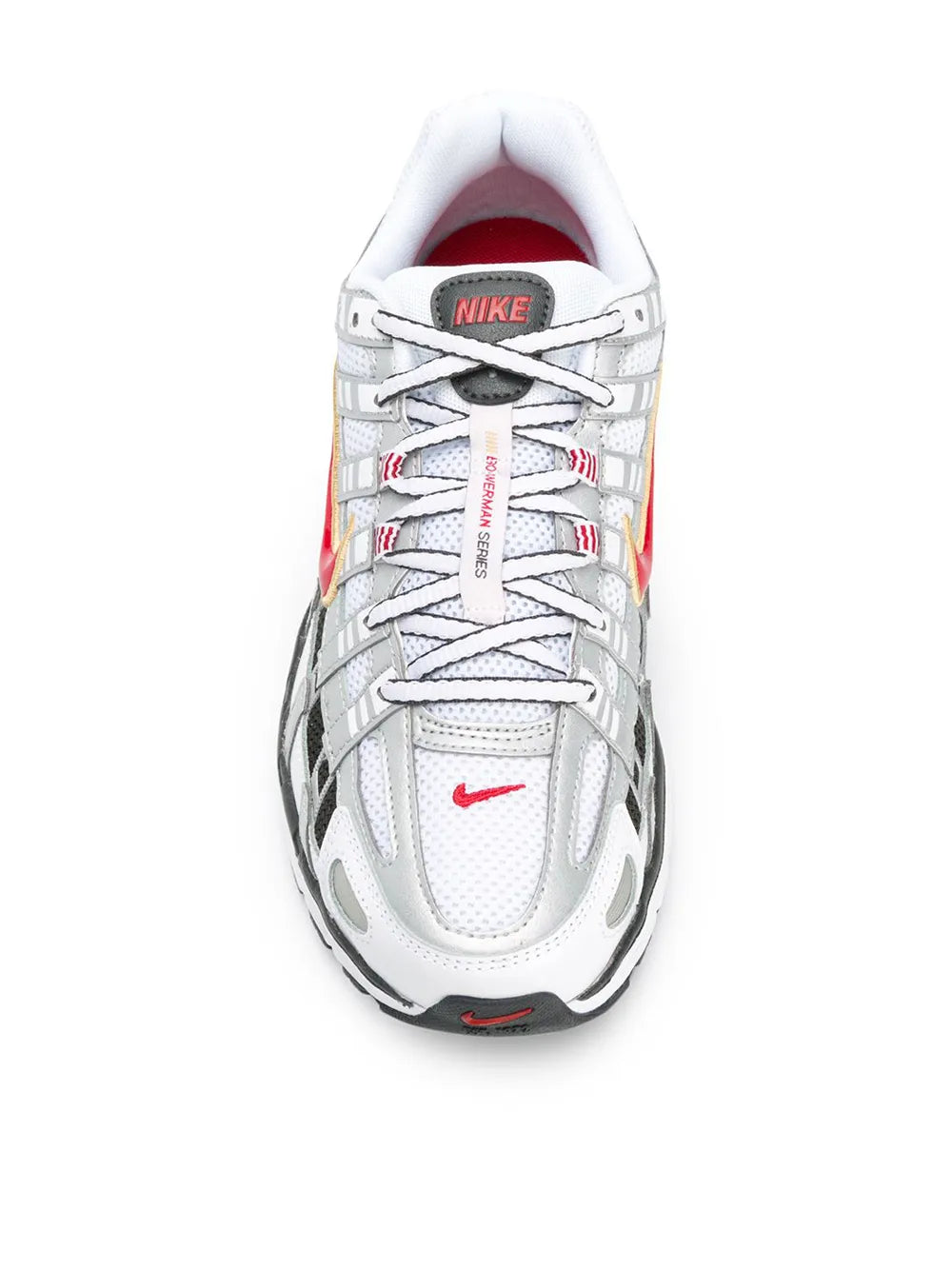 White low-top sneaker, lace-up front, Nike logo on tongue, red heel accents.