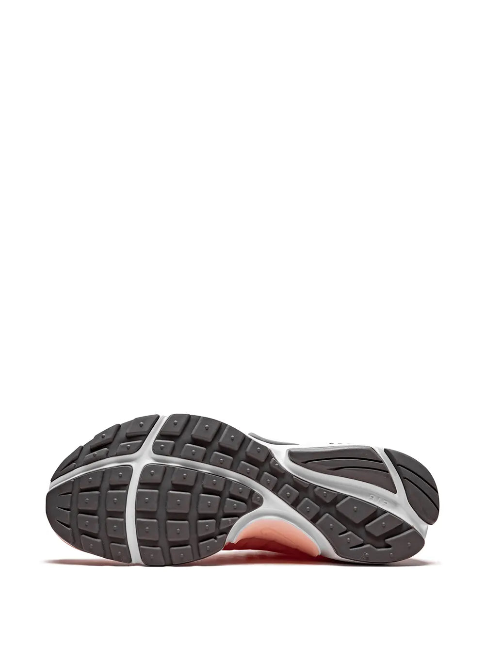 Outsole view of pink knit sneakers with dark rubber tread and white sidewall