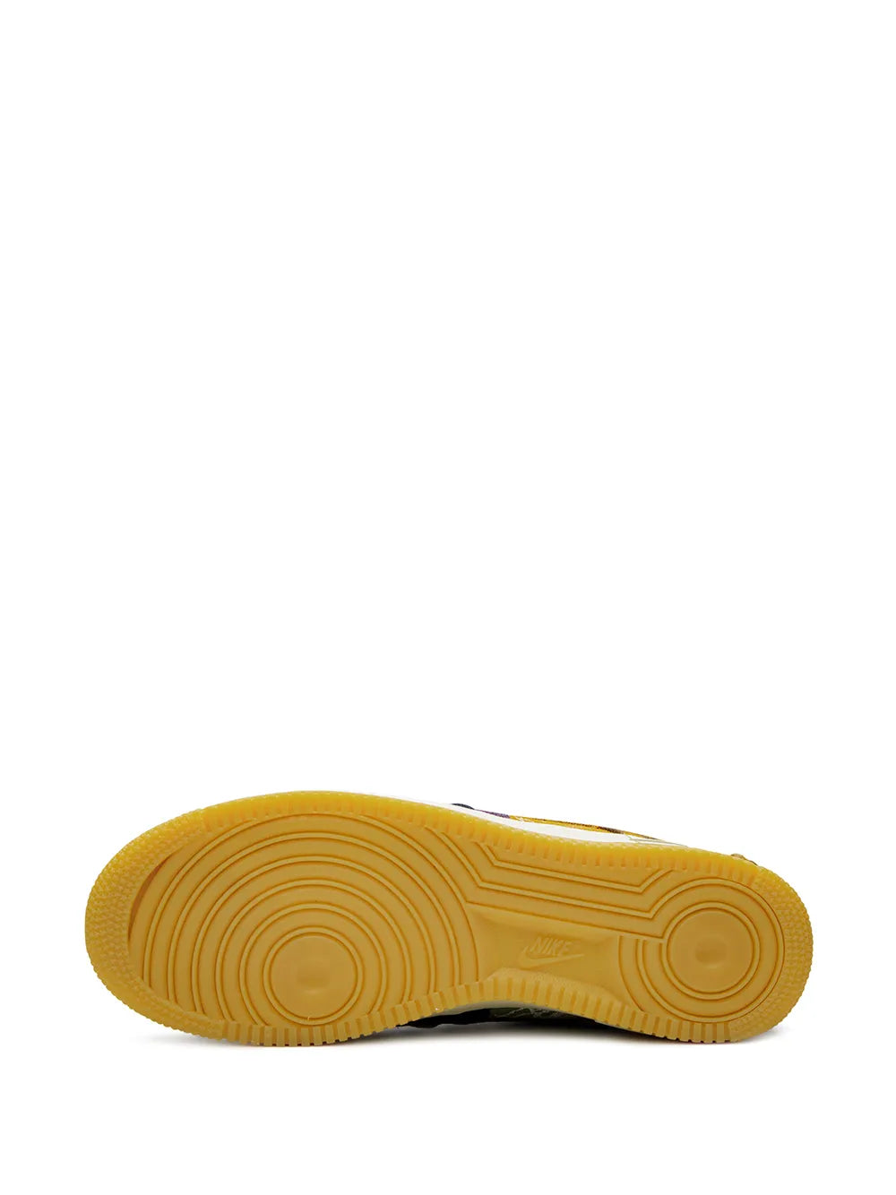 Shoe outsole view: yellow rubber traction sole with circular tread pattern