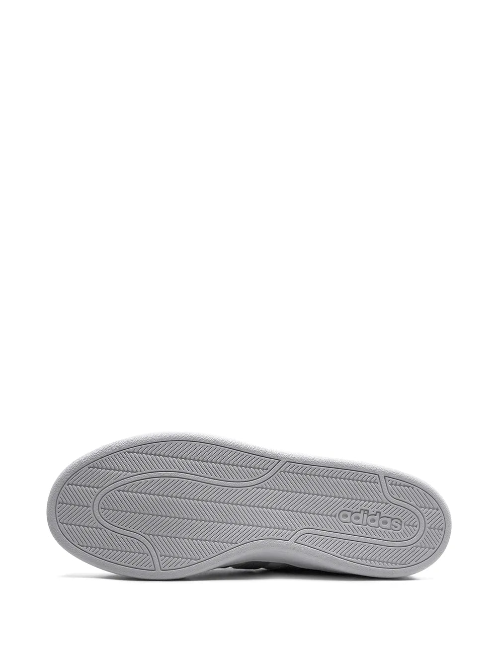 Gray adidas sneaker outsole with textured tread
