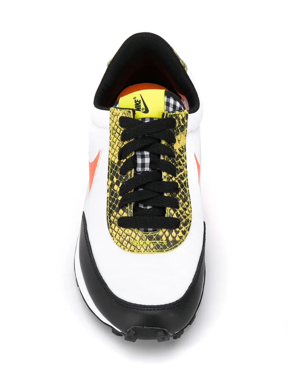 White and black low-top sneaker with NIKE-branded yellow laces and patterned toe