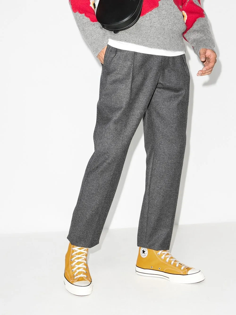 Yellow high-top canvas sneakers on model with white soles and laces