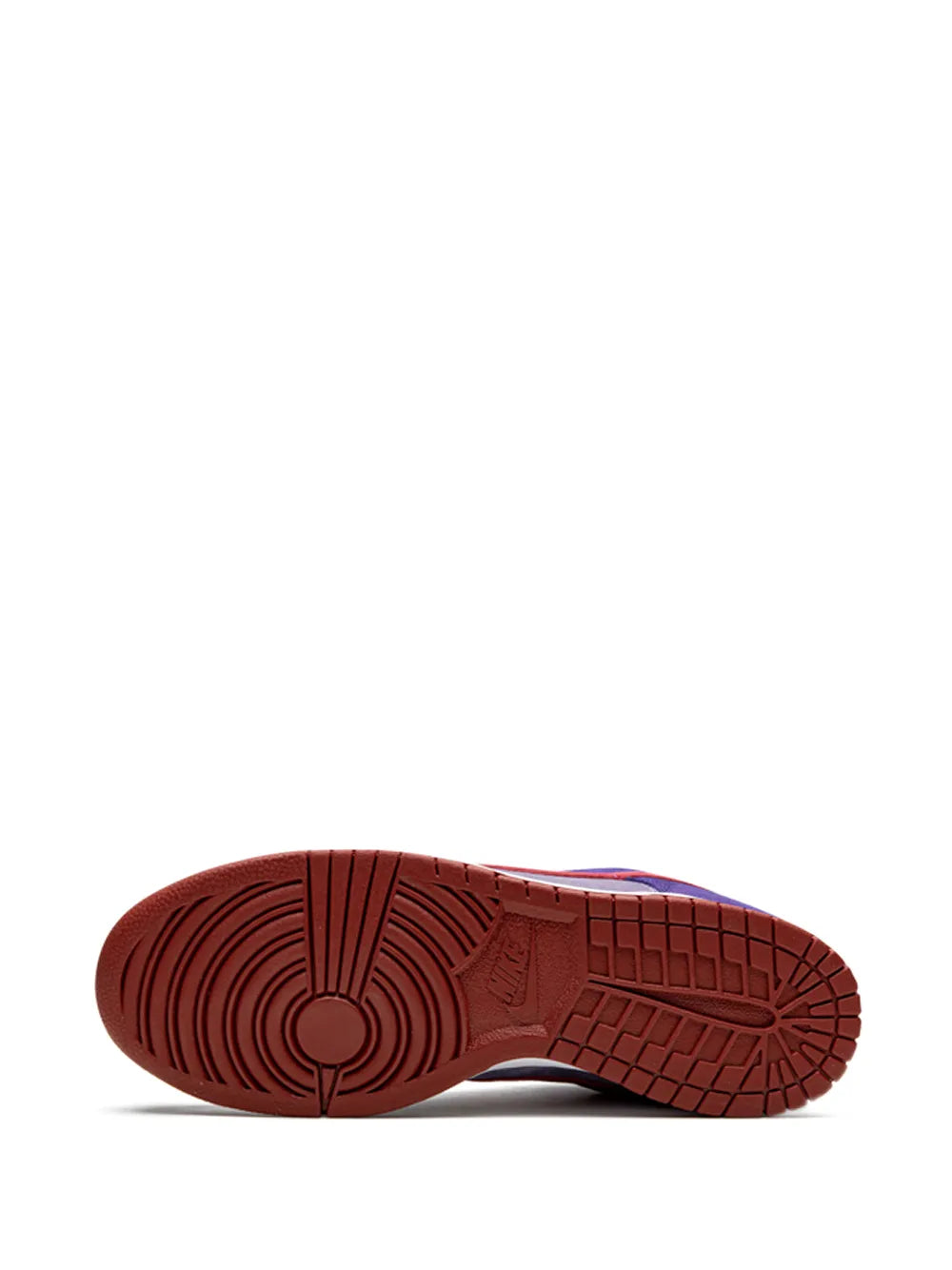 Reddish-brown rubber outsole with tread pattern on low-top sneakers