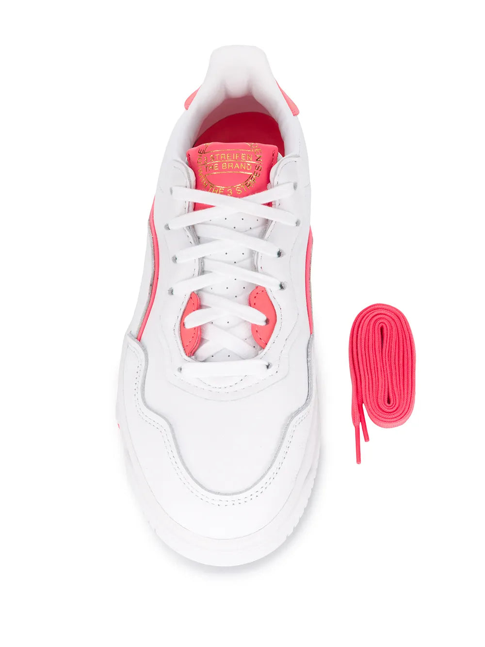 White adidas SC Premiere low-top sneaker interior view with pink laces and tag