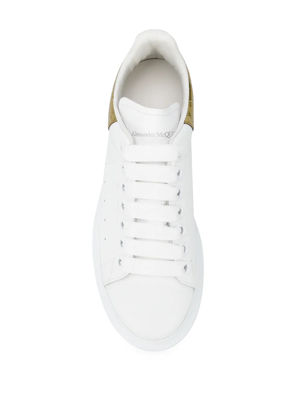 White low-top sneaker with white laces and logo patch on tongue, thick rubber sole