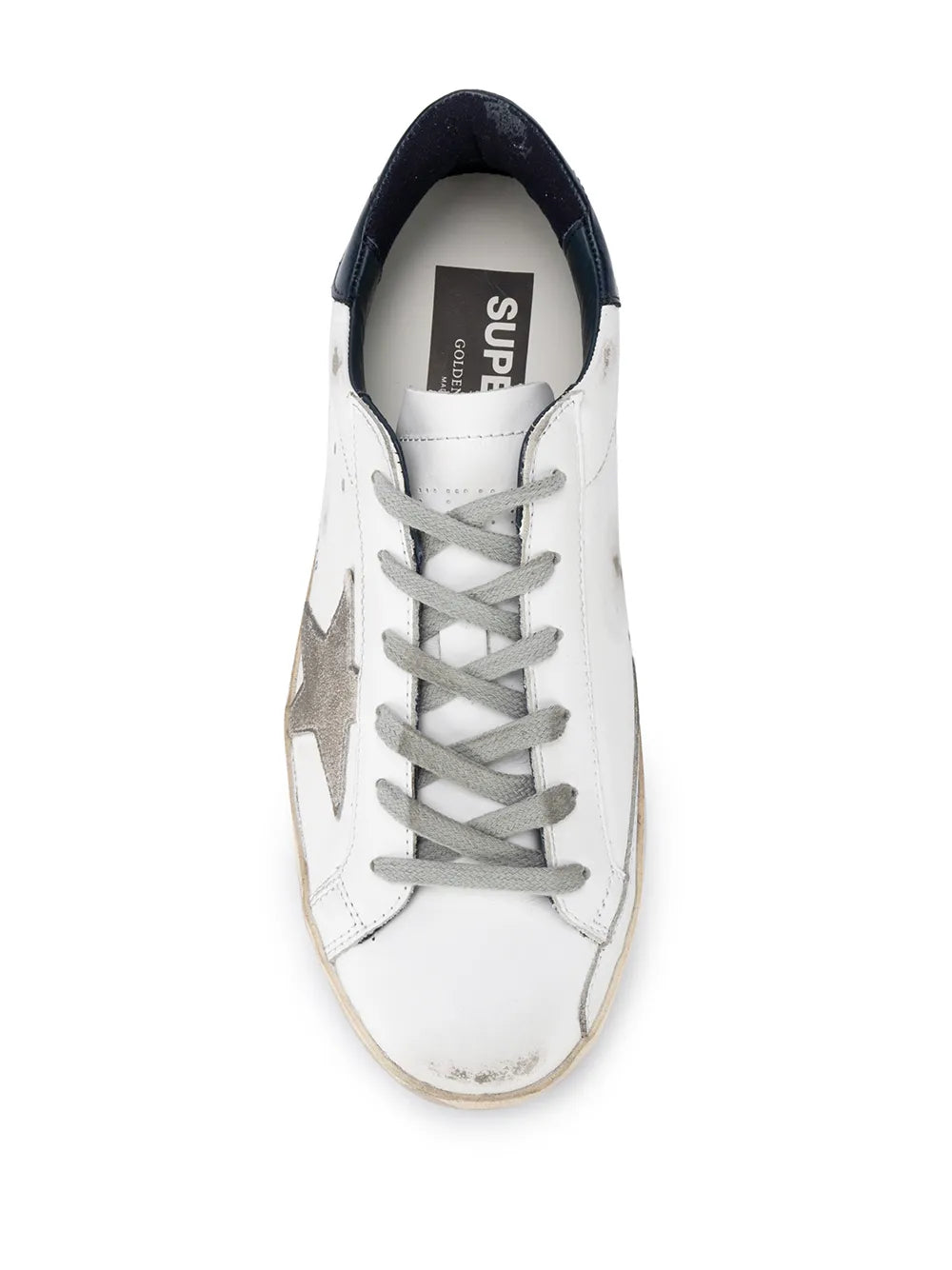 Super-Star sneaker with white upper, gray laces, navy collar, and 'SUPERSTAR' tongue label
