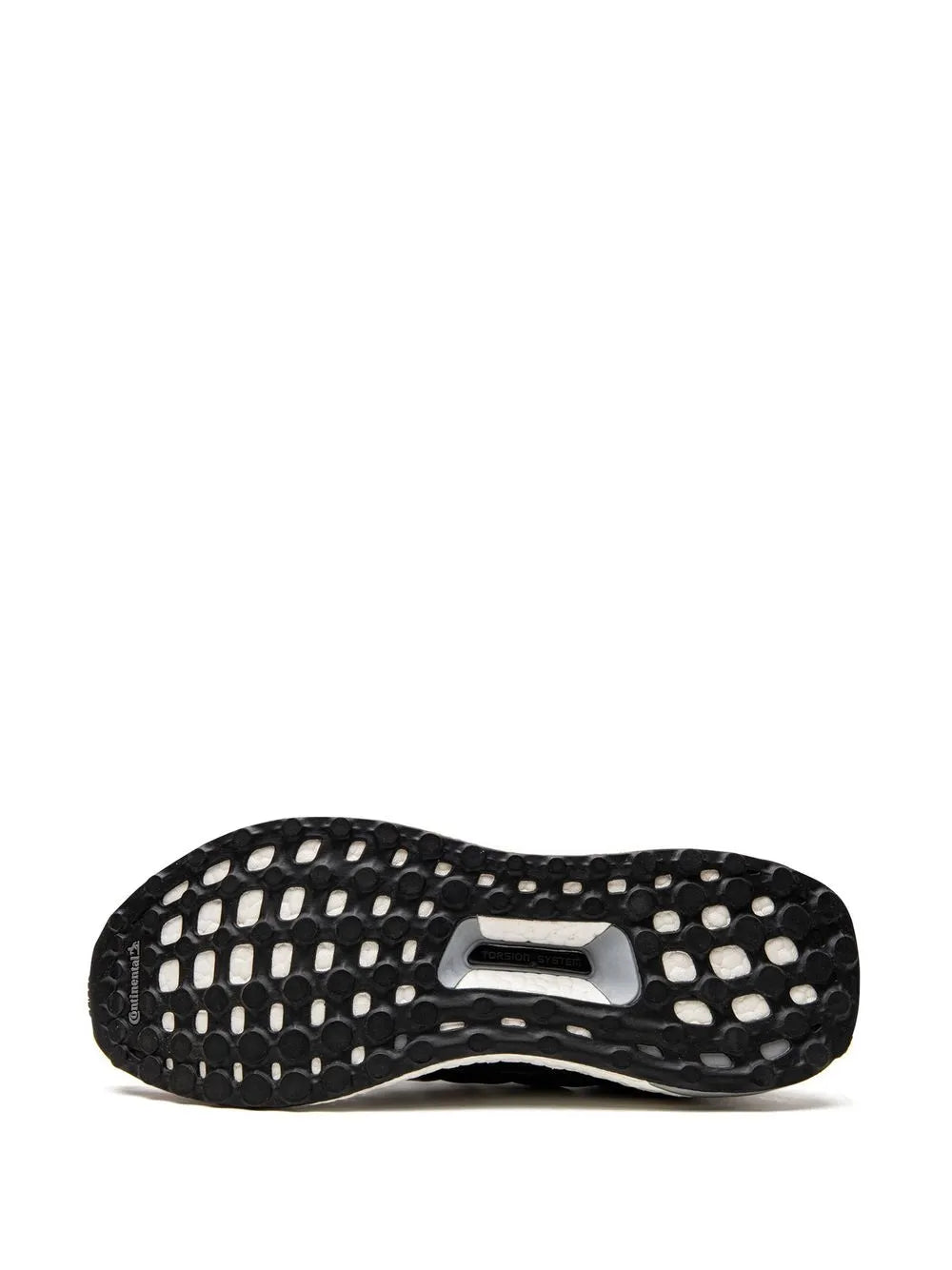 Outsole of running shoe with black tread pattern and textured traction pods