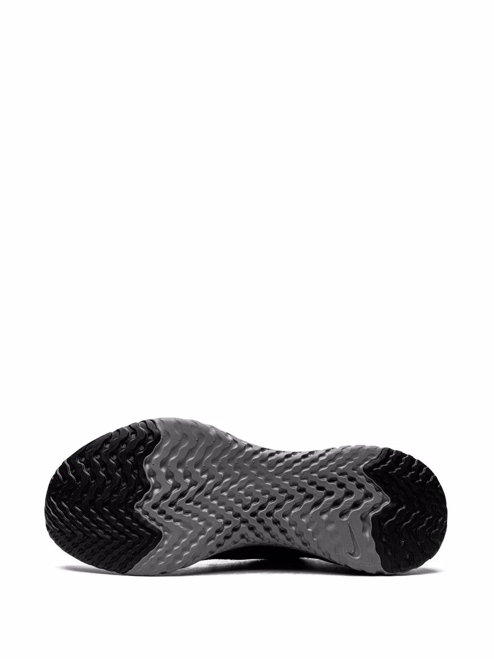 Black outsole view of knit sneaker with treaded rubber pattern