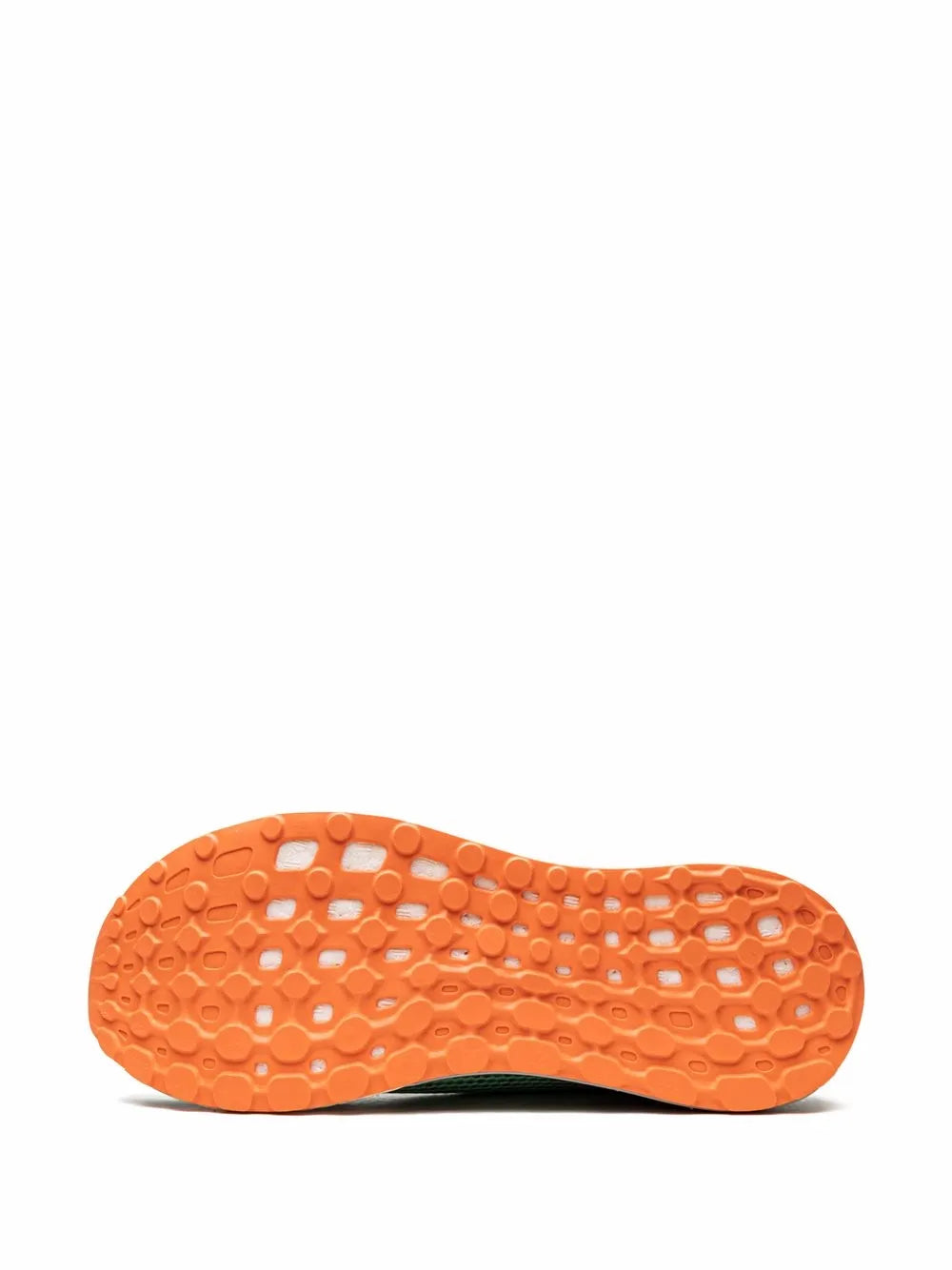 Orange rubber outsole for a low-top sneaker with textured traction pads