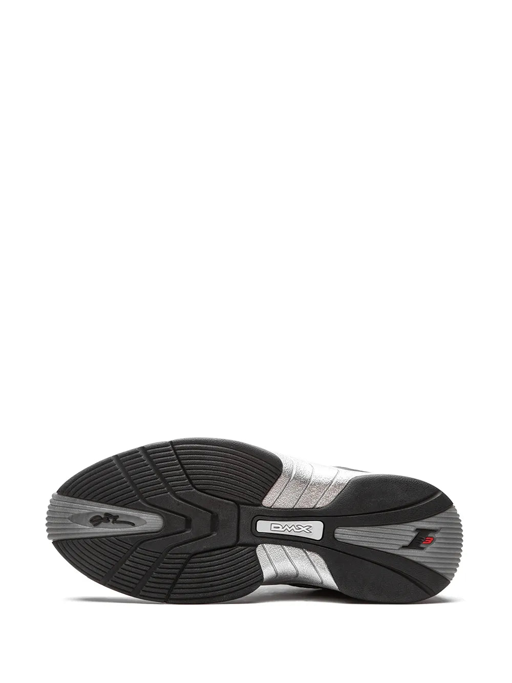 Black and silver sneaker outsole view with tread and DMX logo