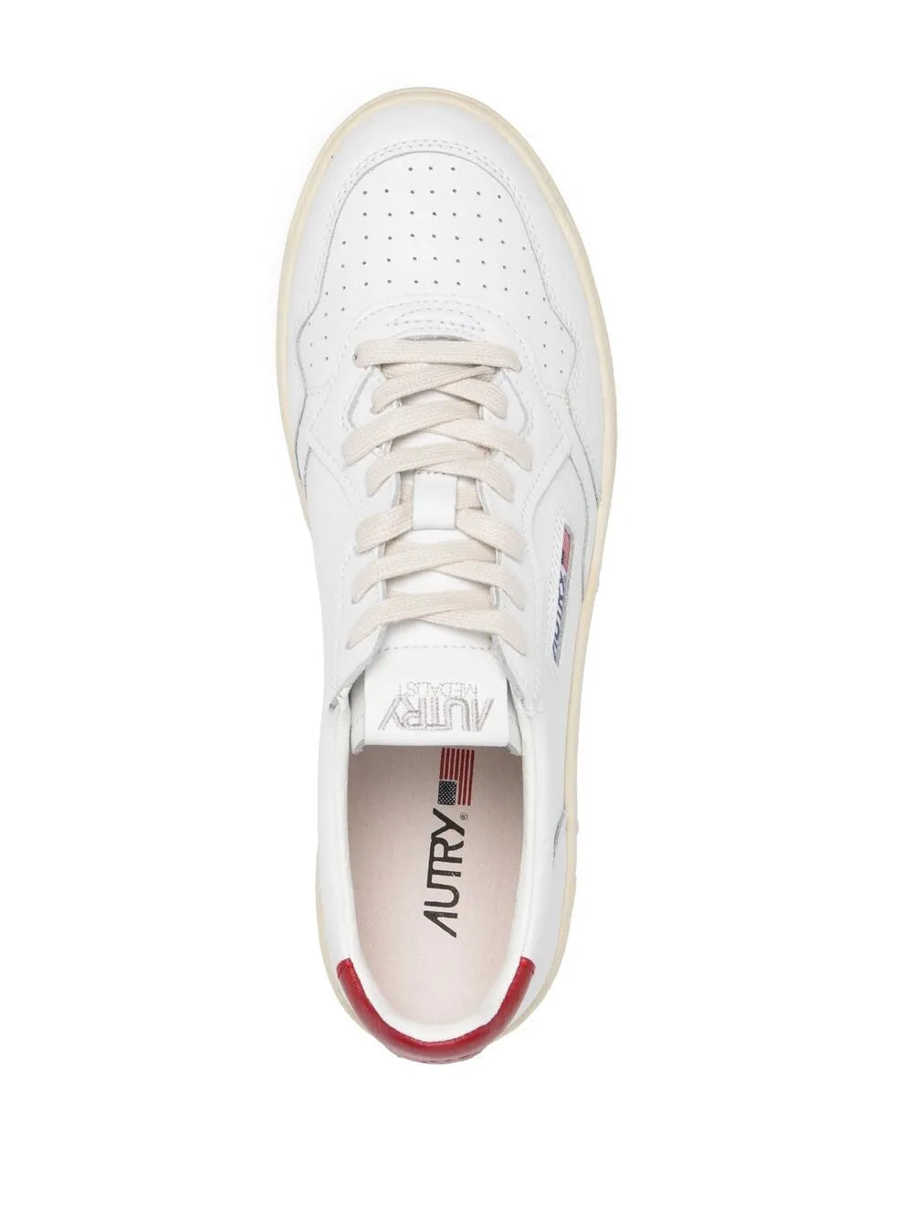White low-top sneaker with lace-up front, red heel lining, brand on insole