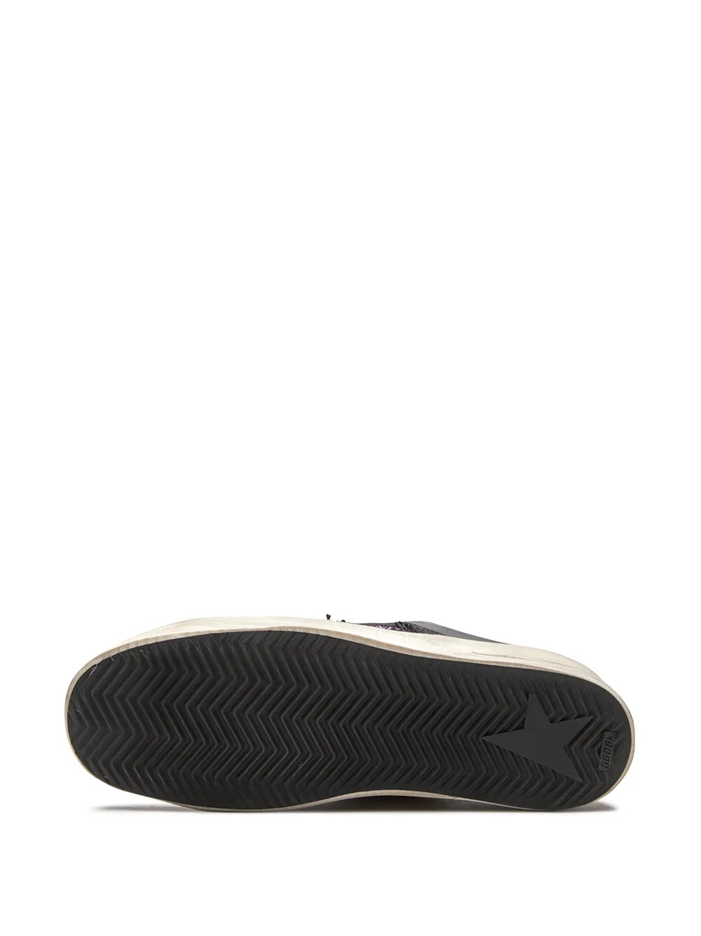 Sneaker outsole with dark zigzag tread pattern and beige midsole edge