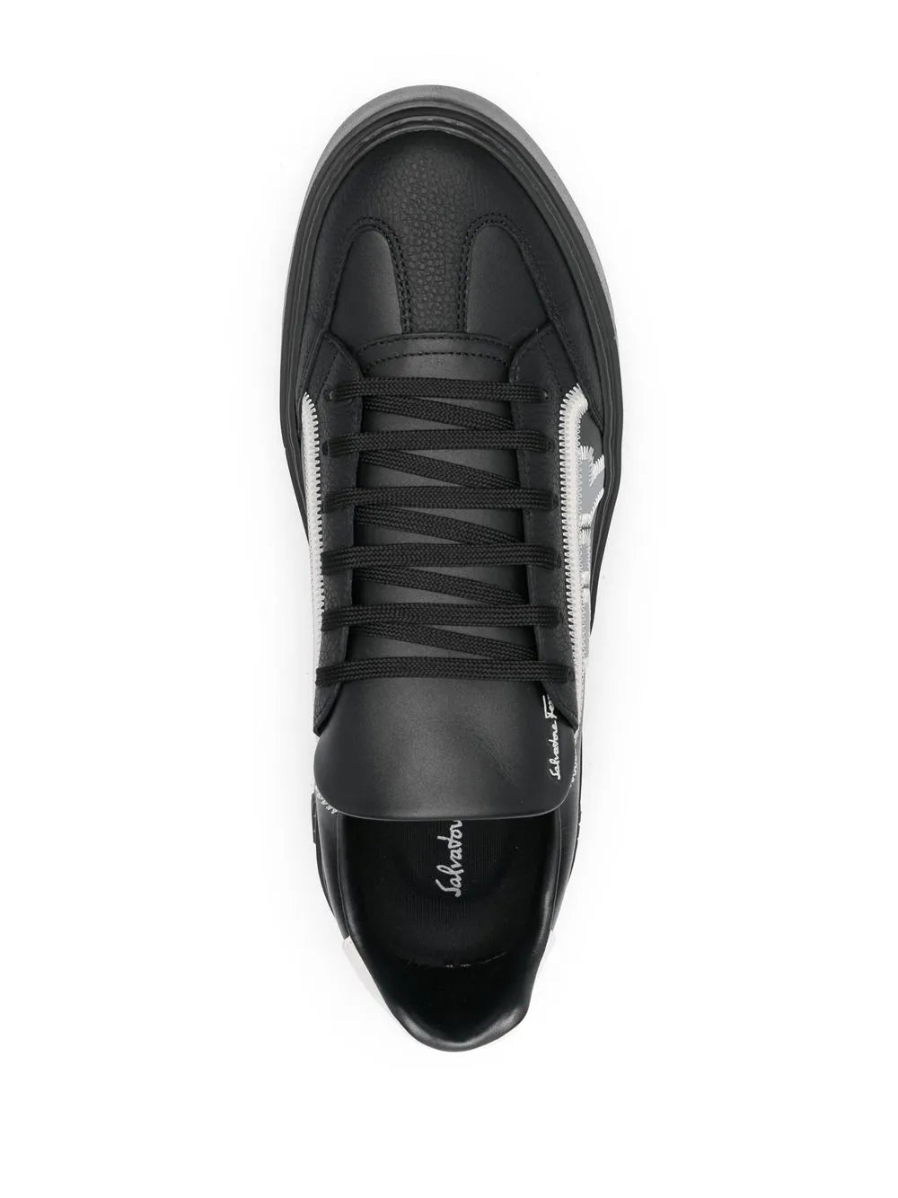 Black lace-up sneakers with front view, black laces and white Gancini print accents