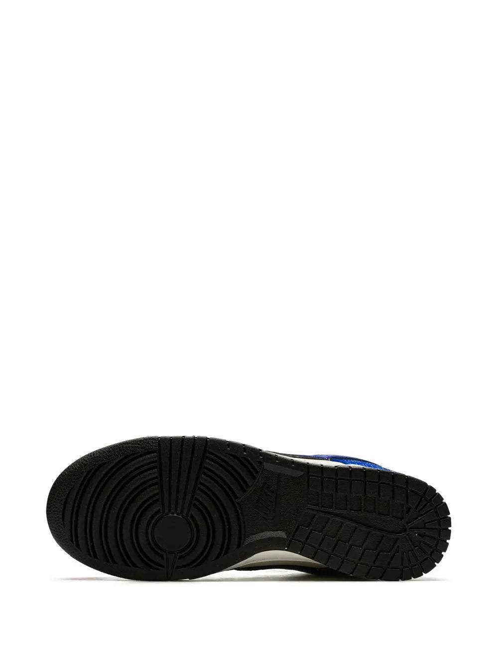Rubber outsole tread of a blue and white low-top sneaker