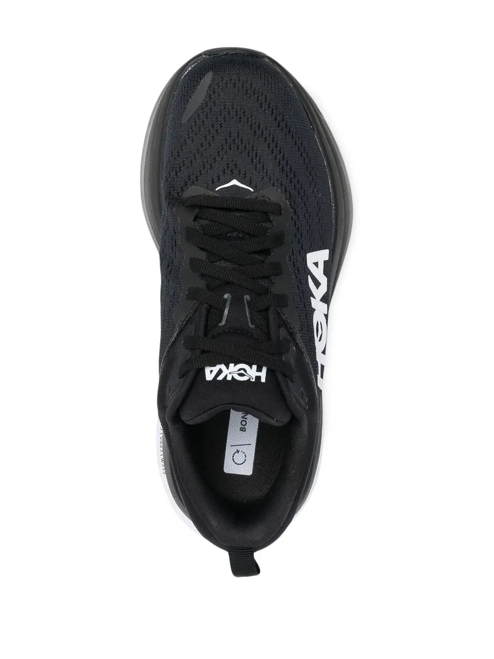 Black low-top running shoe interior with laces and insole label, top view