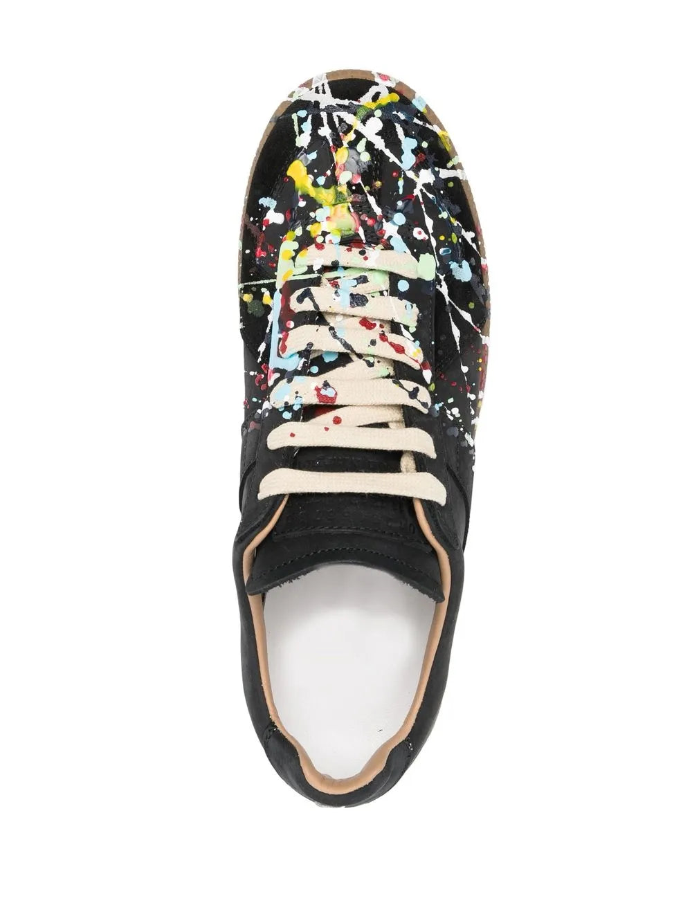 Black low-top sneaker with multicolor paint splatter, off-white lace-up and round toe