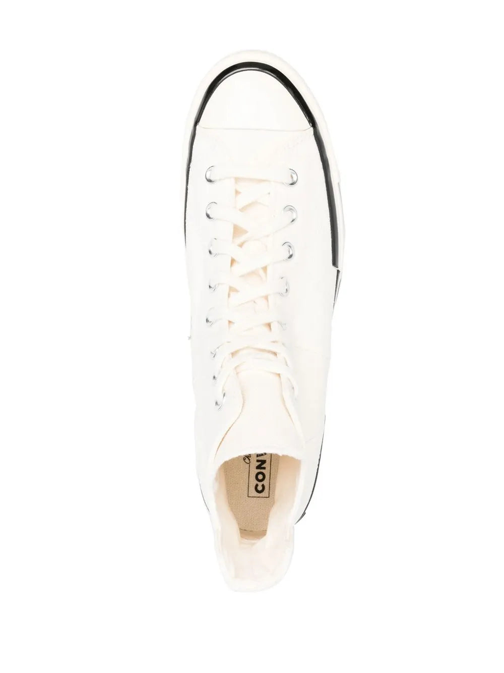 White Converse high-top sneaker, interior view with lace-up eyelets and rubber sole.