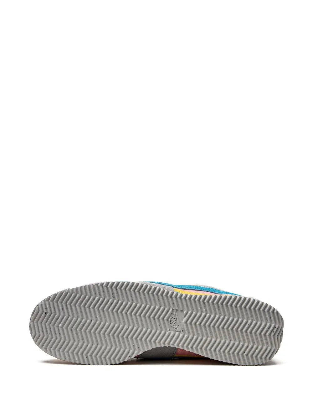 Grey sneaker outsole with zigzag tread and embossed logo