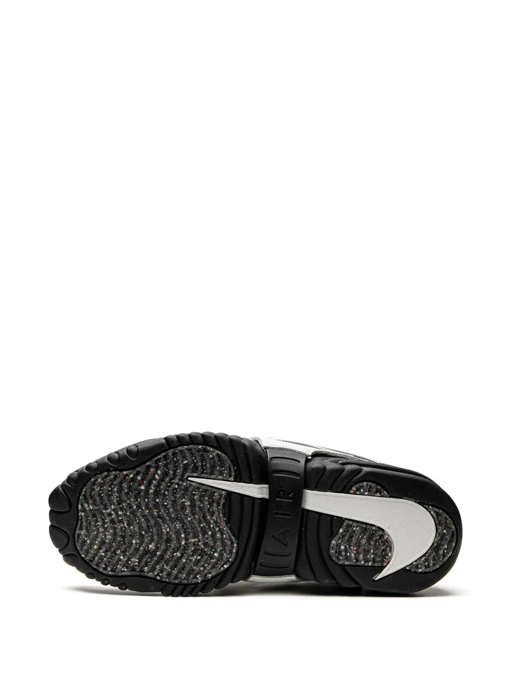 Black sneaker outsole and toe view with tread and Nike branding