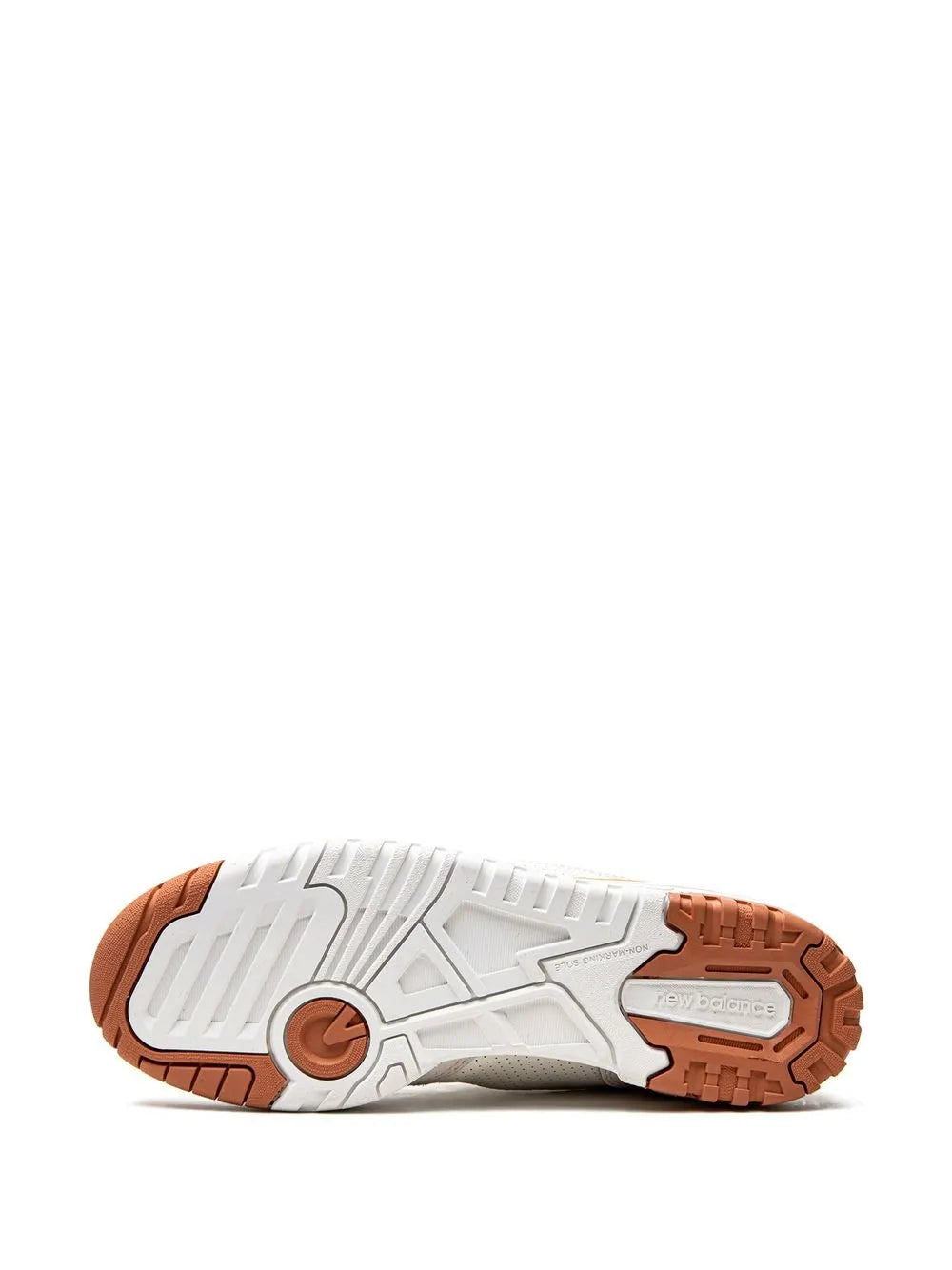 White sneaker outsole with brown traction pods and cushioned midsole