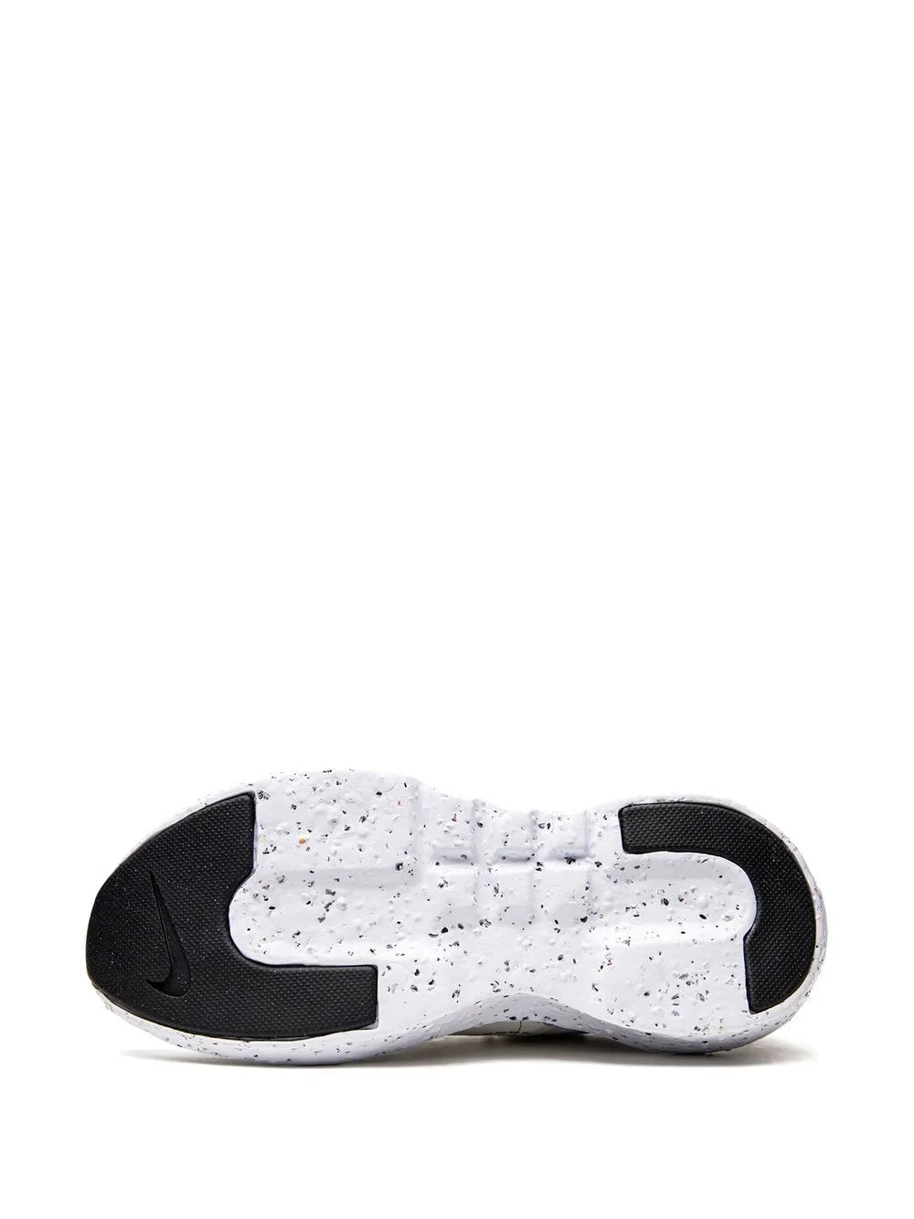 White Nike sneaker outsole, speckled foam with black heel and toe panels