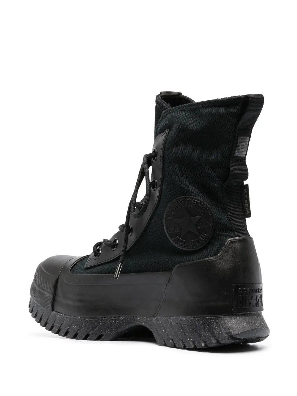 Black high-top canvas boot with lace-up, textured toe bumper and lug rubber outsole
