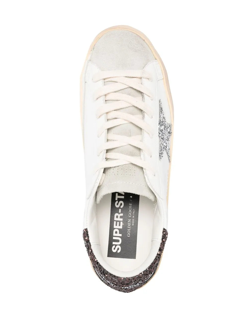 White low-top sneaker tongue lining with lace-up front; black glitter trim