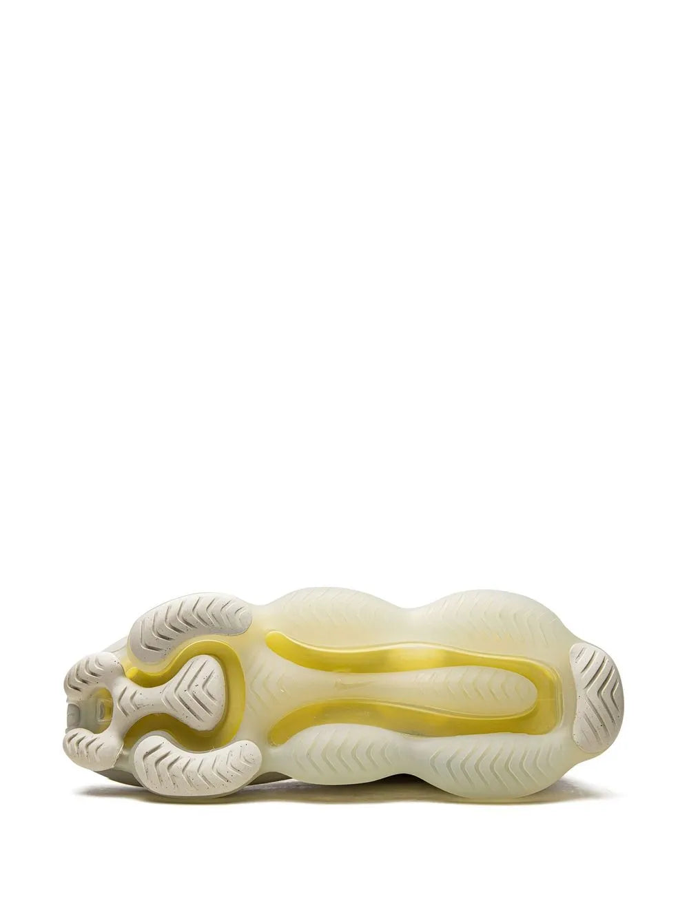 White outsole underside of sneaker with yellow air unit and tread pattern.