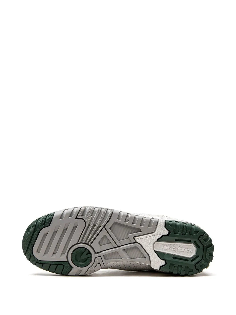 White sneaker outsole with green trim and detailed tread pattern