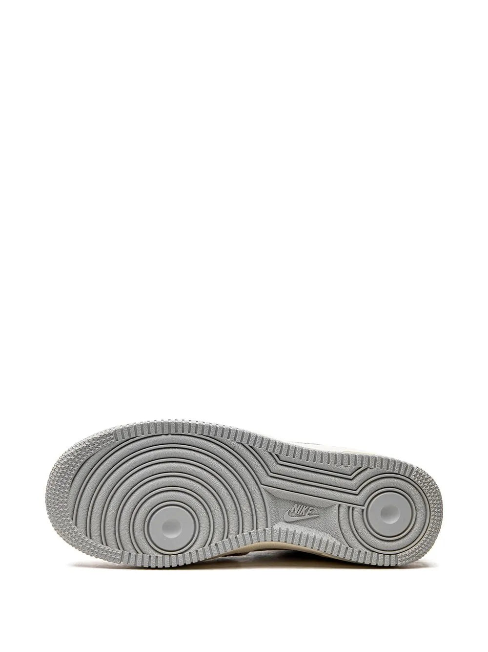 Gray rubber outsole for Nike high-top sneaker, circular traction pattern