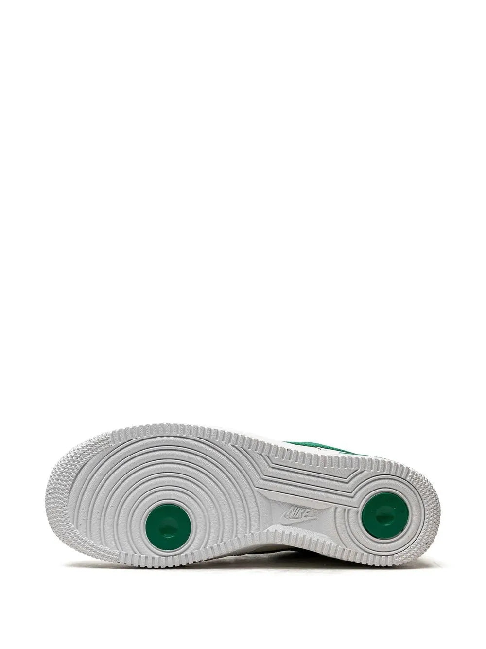 Nike low-top sneakers outsole with textured white rubber and green traction inserts