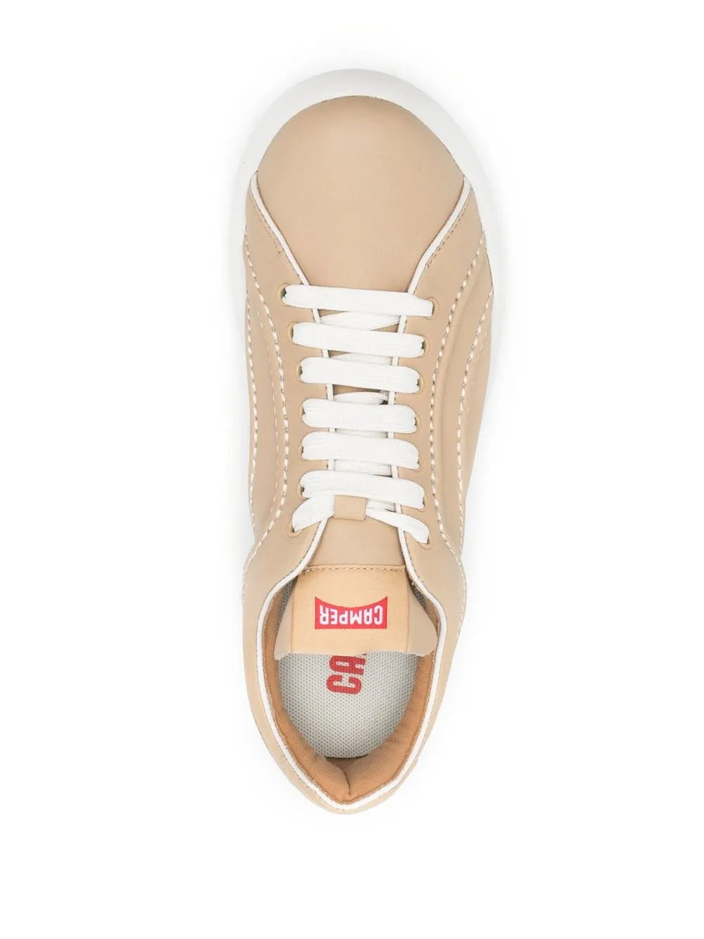Beige low-top sneaker with white lace-up closure and brand label inside