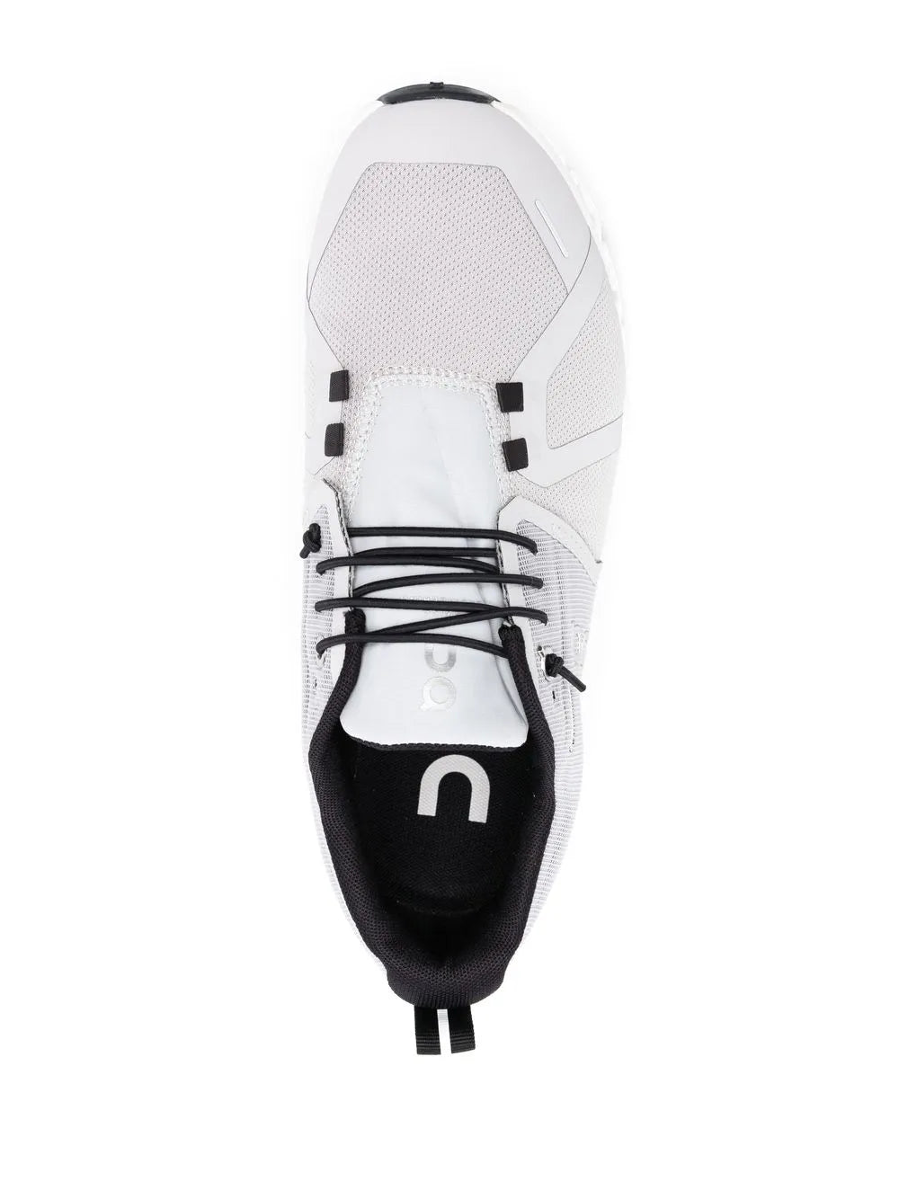 White and black low-top running shoe with lace-up closure and padded tongue