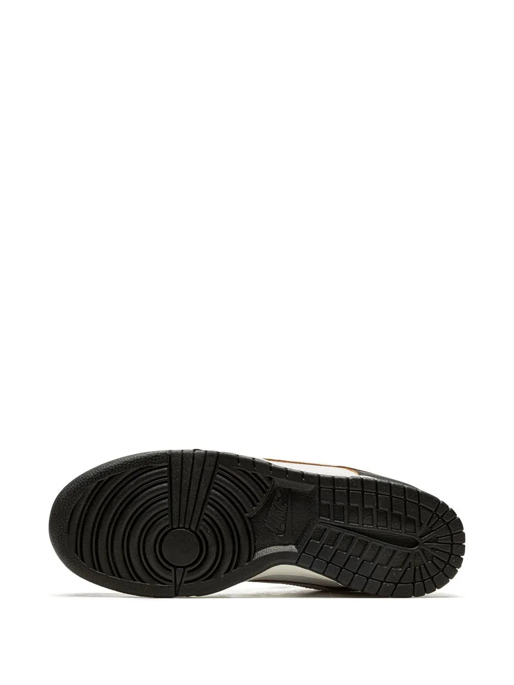 Black low-top sneaker outsole with circular tread pattern and traction grooves