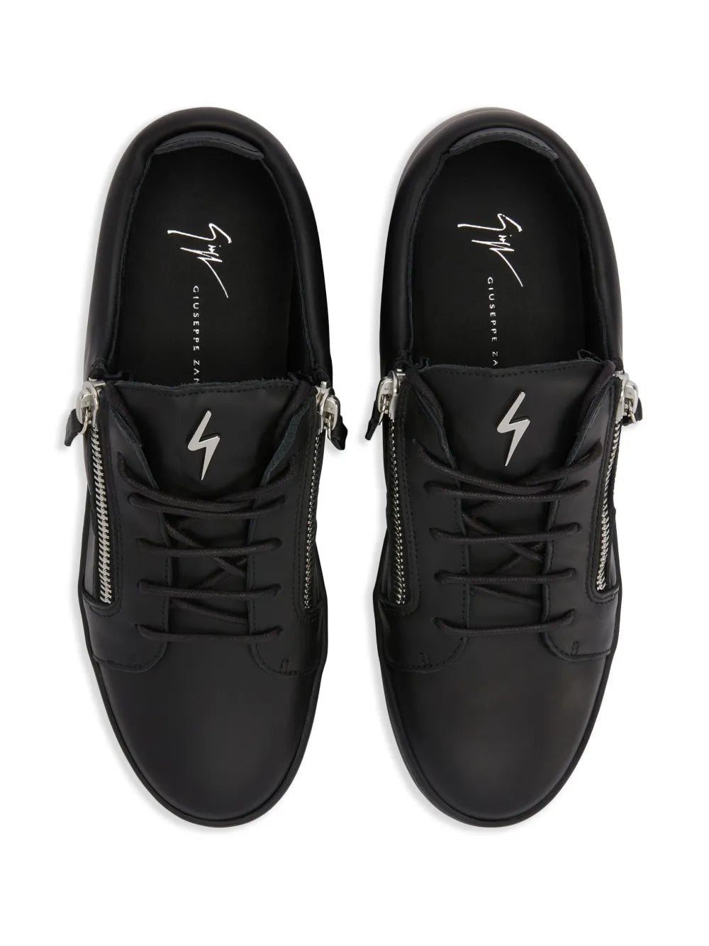 Black low-top sneakers, front view with double zippers and lightning bolt detail