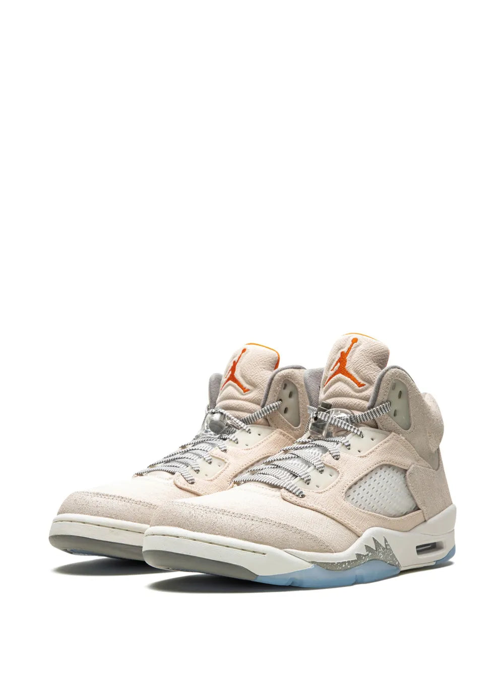 Beige Air Jordan 5 lace-up sneakers, side view with gray suede overlays and orange hits