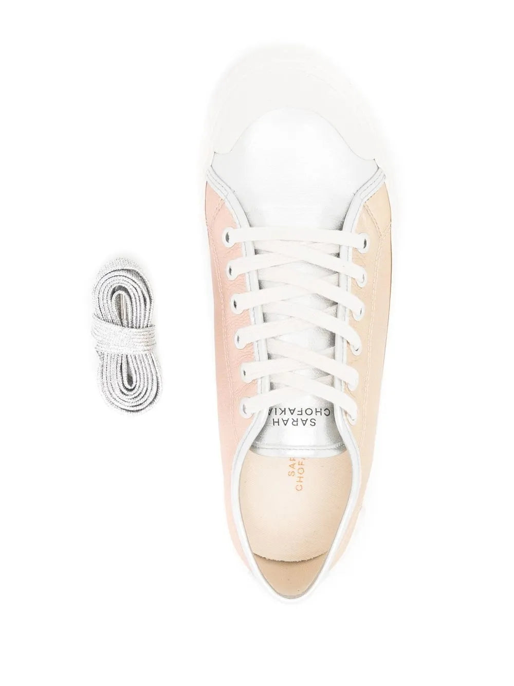 Low-top sneaker with white laces and spare lace bundle, pink metallic upper