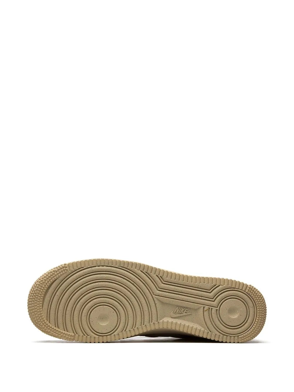 Light brown rubber outsole with circular tread patterns and traction grooves