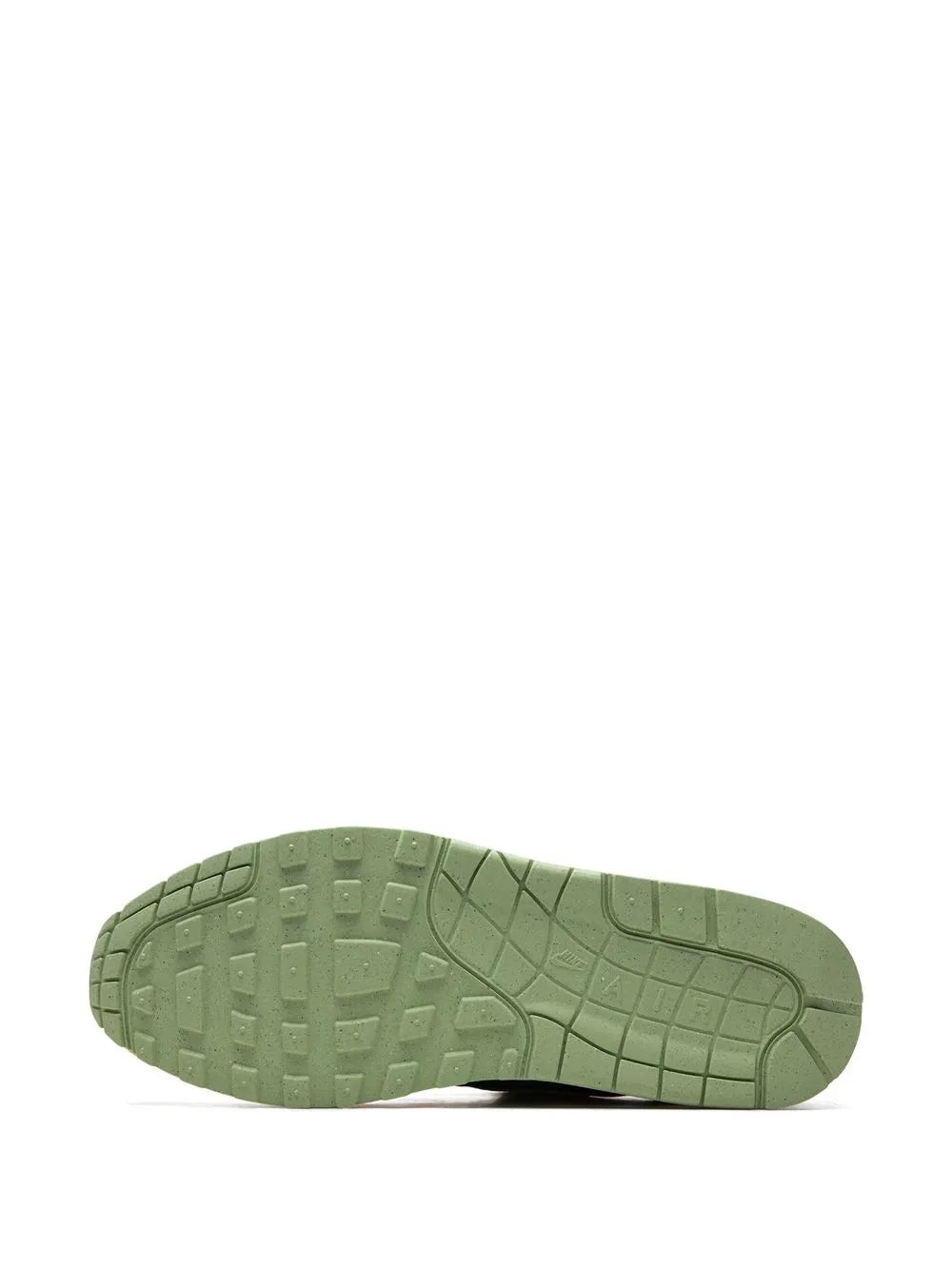 Green rubber outsole with tread pattern for traction