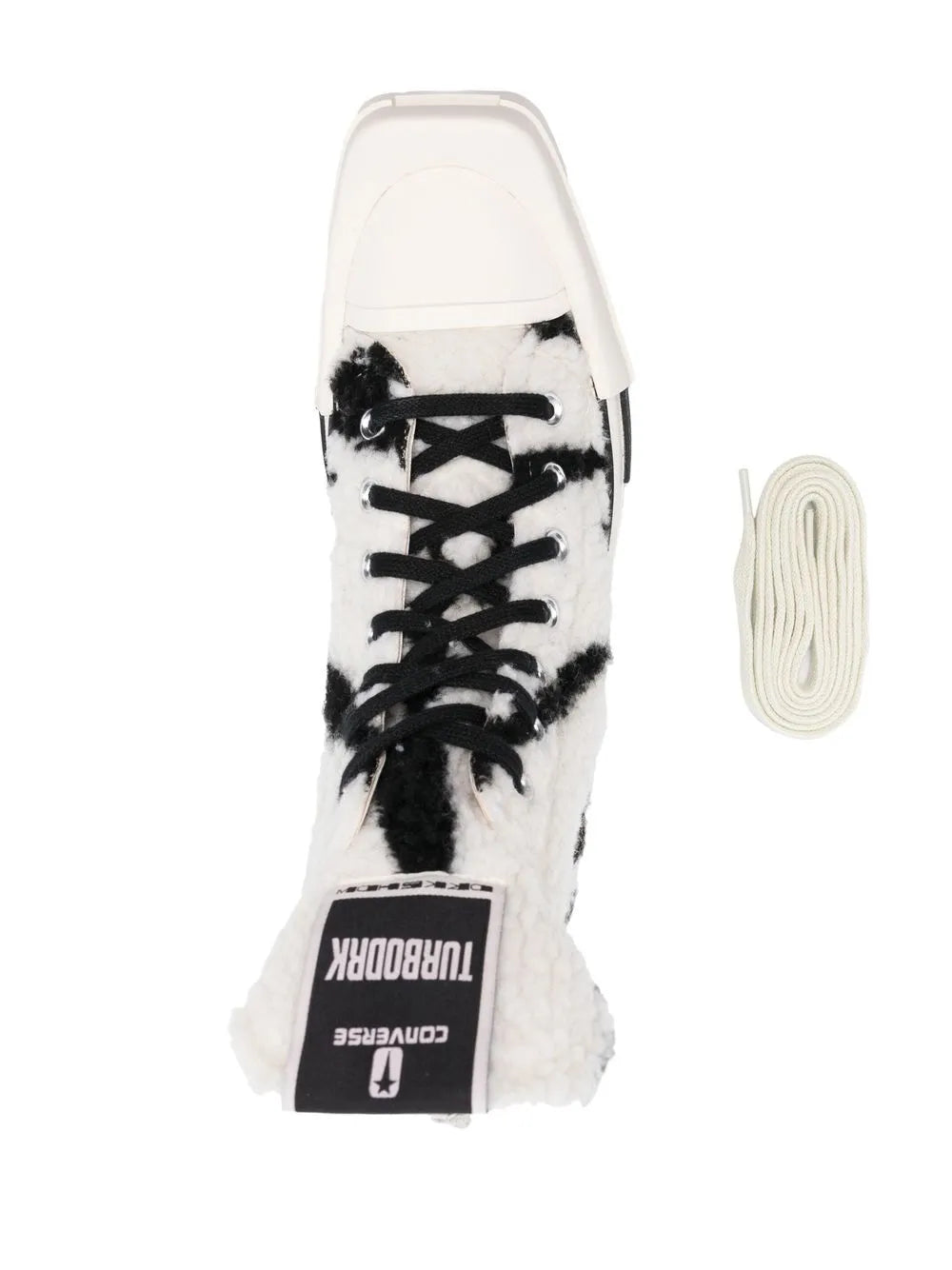 Close-up high-top sneakers with black lace-up panel and Converse logo tongue label