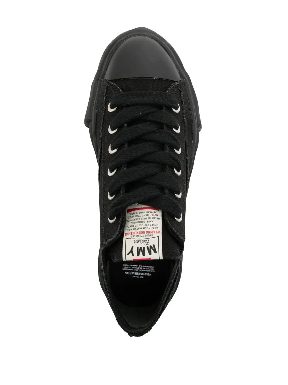 Black low-top canvas sneakers, lace-up with tongue label and padded collar